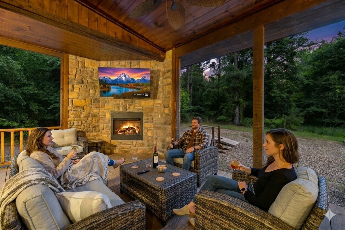 Savor the warmth of the fire and the company of loved ones as you unwind with a glass of wine by the outdoor fireplace.
