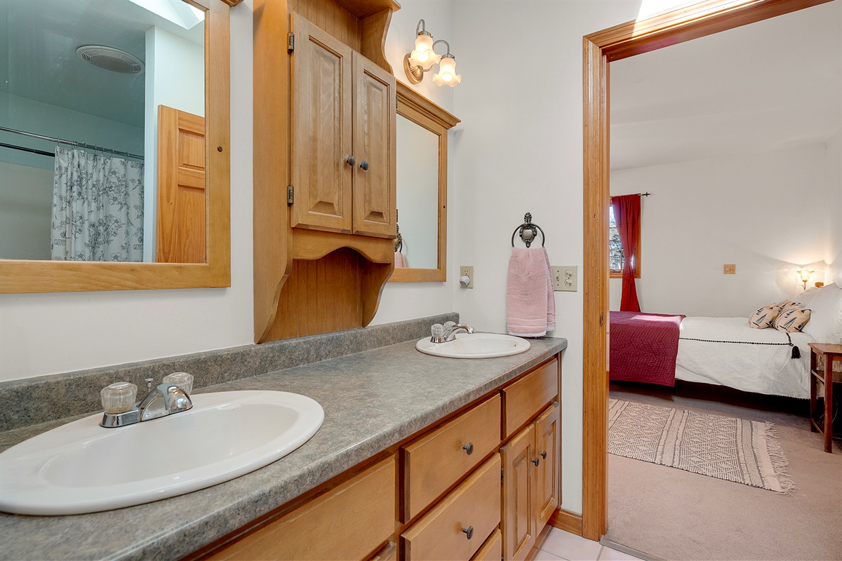 Primary bathroom en-suite with shower and separate toileting area 