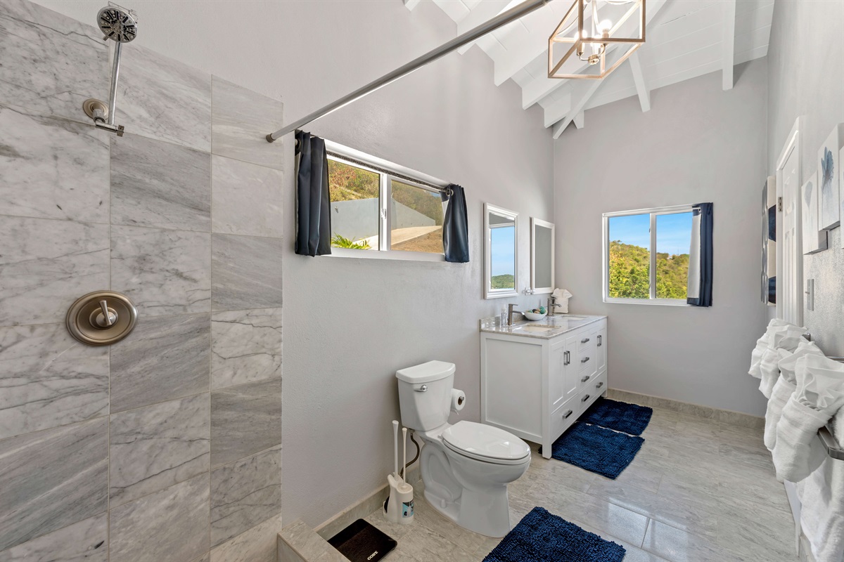 Spacious bathroom with elegant fixtures and thoughtful design touches.