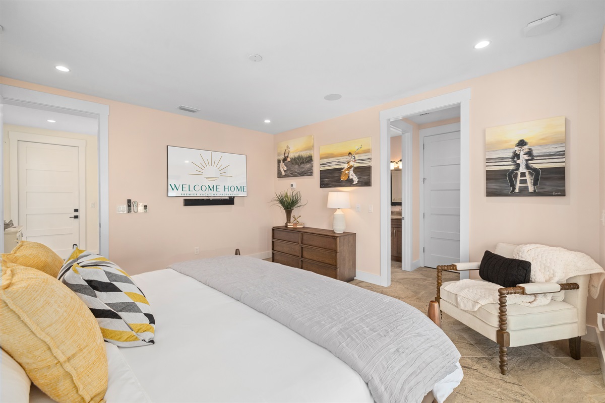 Comfortable bedroom retreat with seating area and coastal charm