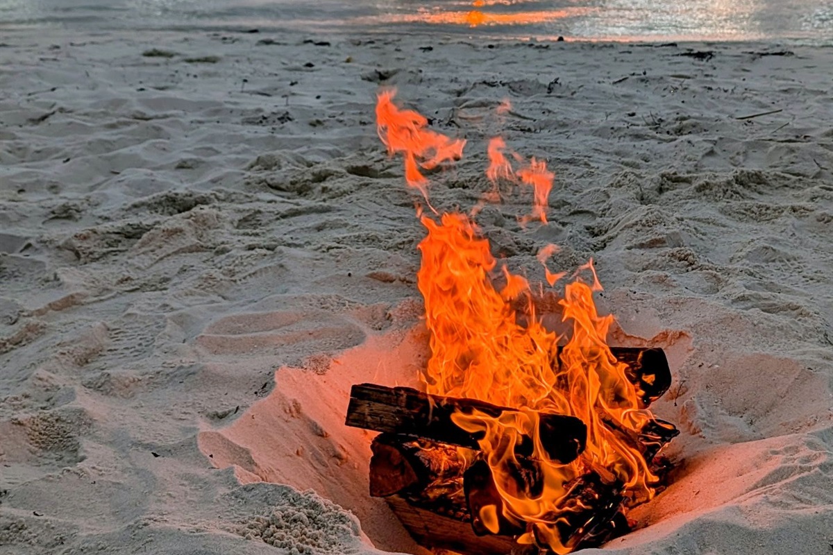 Make memories by the fire with a beach bonfire experience.