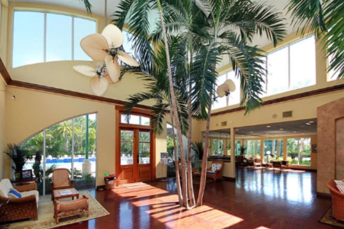 Clubhouse lounge areas with tables and nearby grills