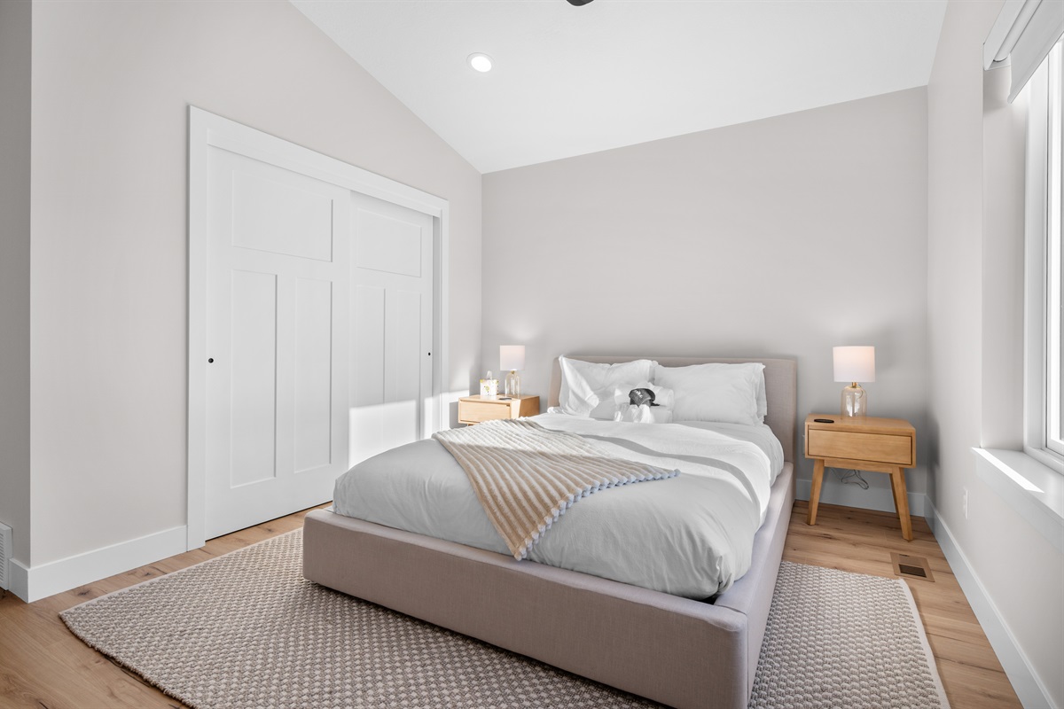 Cozy and inviting Queen Bedroom with ample closet space.