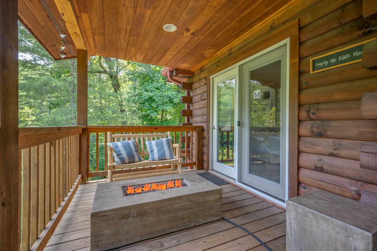 Main level deck overlooking the river with firepit