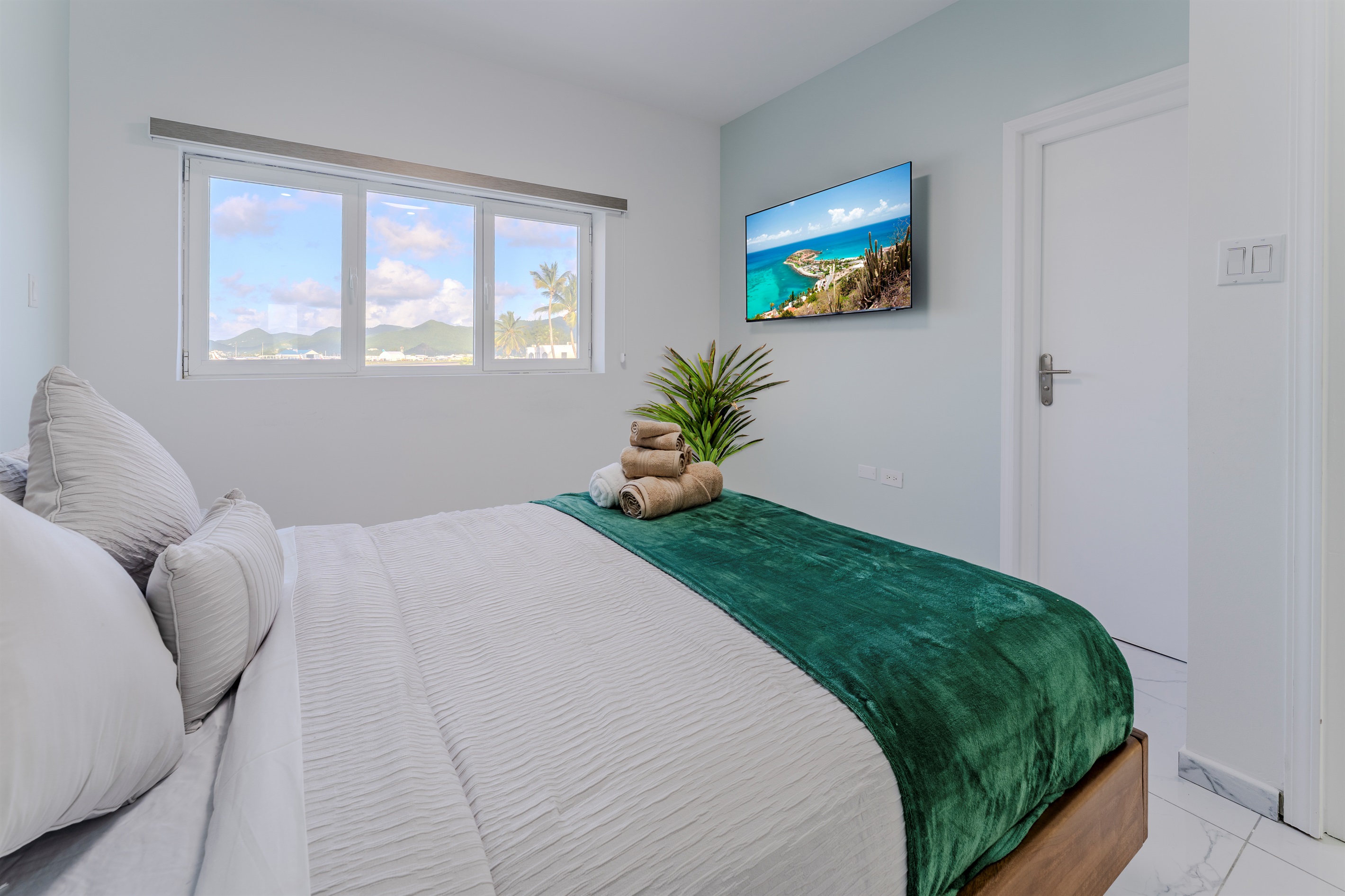 Light‑Filled Bedroom with Queen Bed & Cozy White Linens