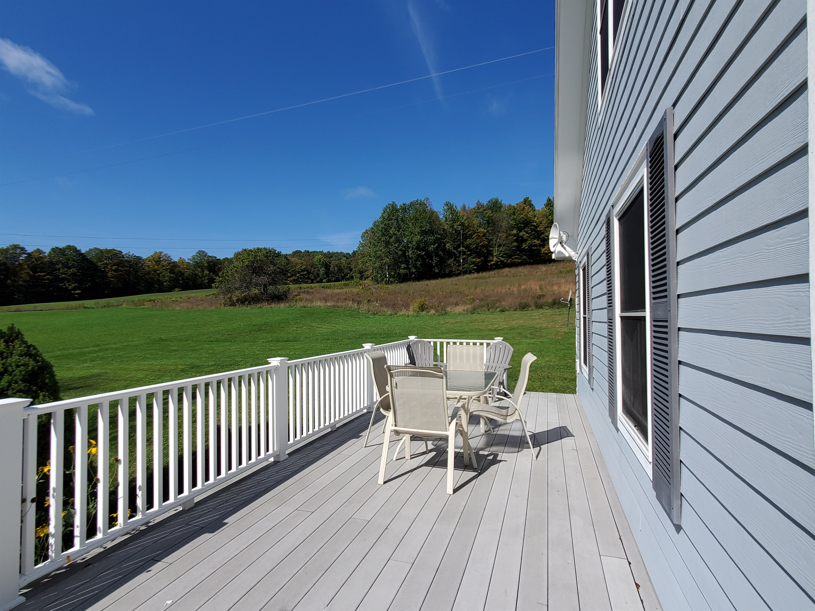 Side porch uncovered portion.