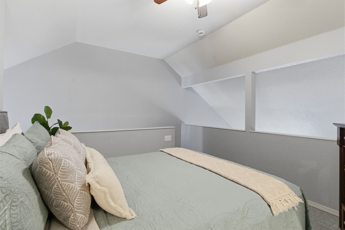 Experience cozy comfort in the second bedroom - complete with a plush queen bed and a TV for your entertainment needs.