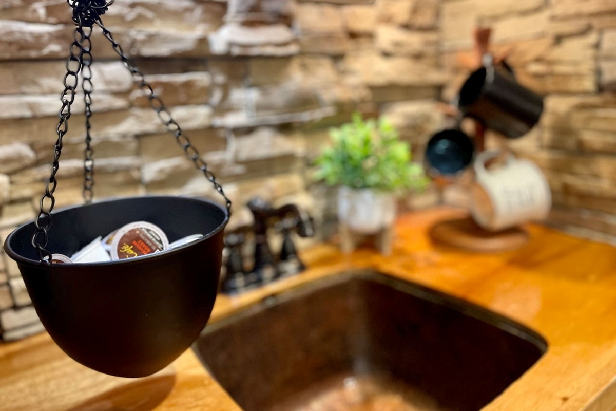 Hammered copper sink and stone adds to the rustic charm. 