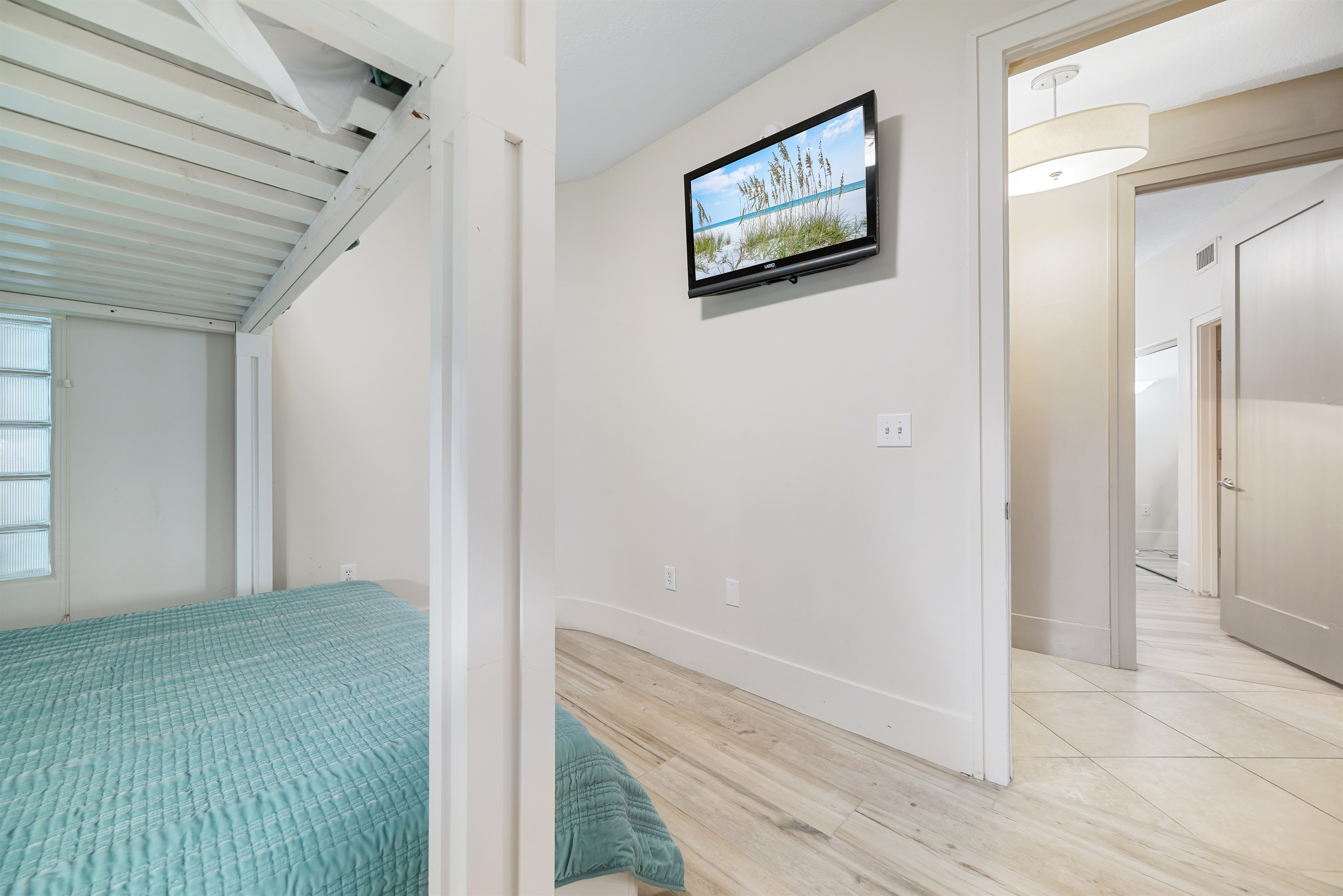 This interior showcases efficient space utilization with a stylish bunk bed arrangement. The thoughtful design maximizes comfort and functionality, creating a versatile room.