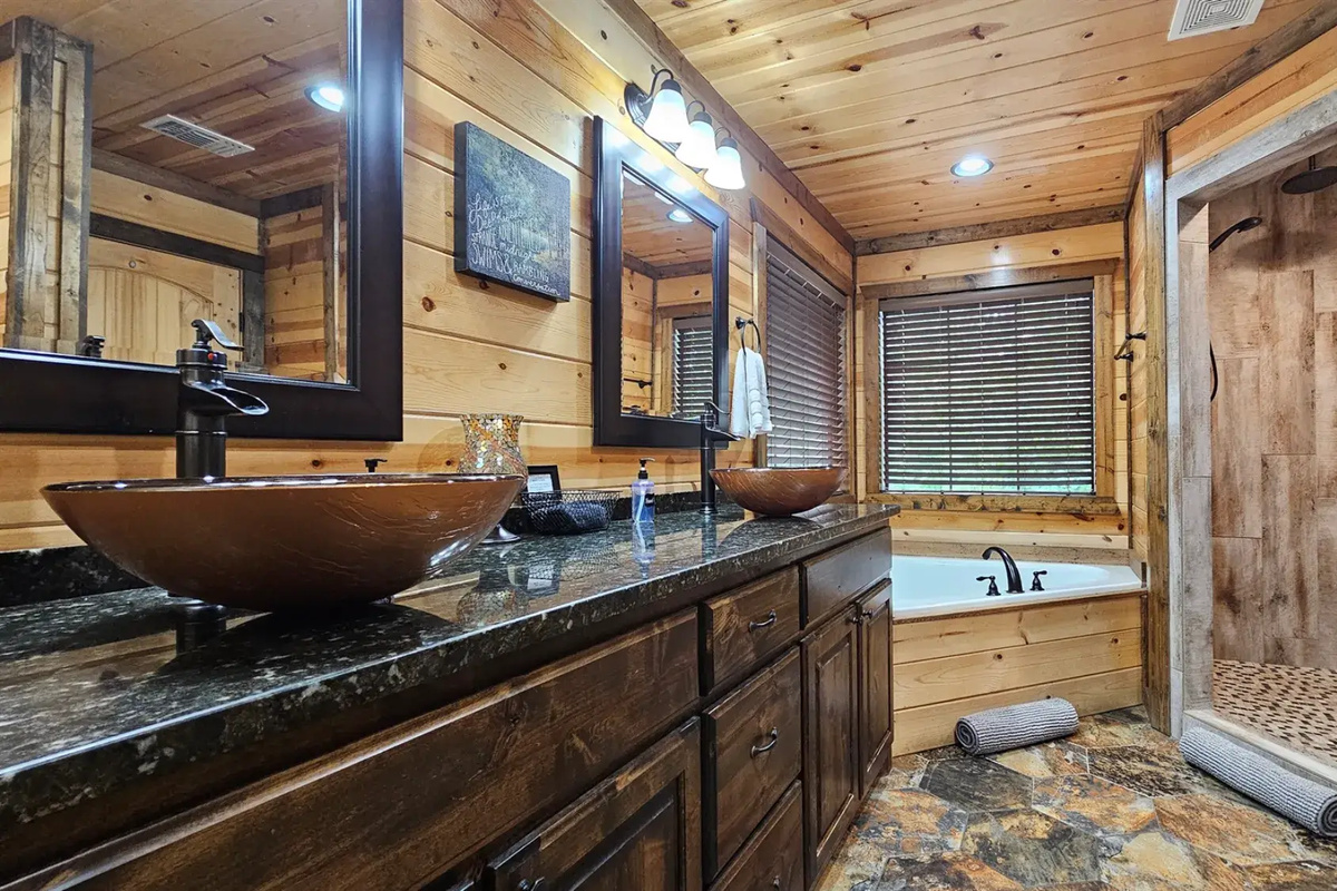 Luxury Bathroom: Unwind in style with a soaking tub and sleek rain shower surrounded by nature!
