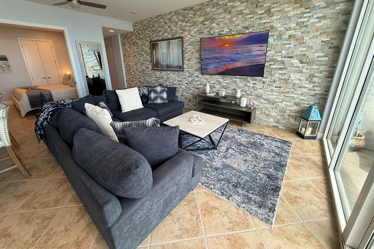 New stone tile with 75" television!