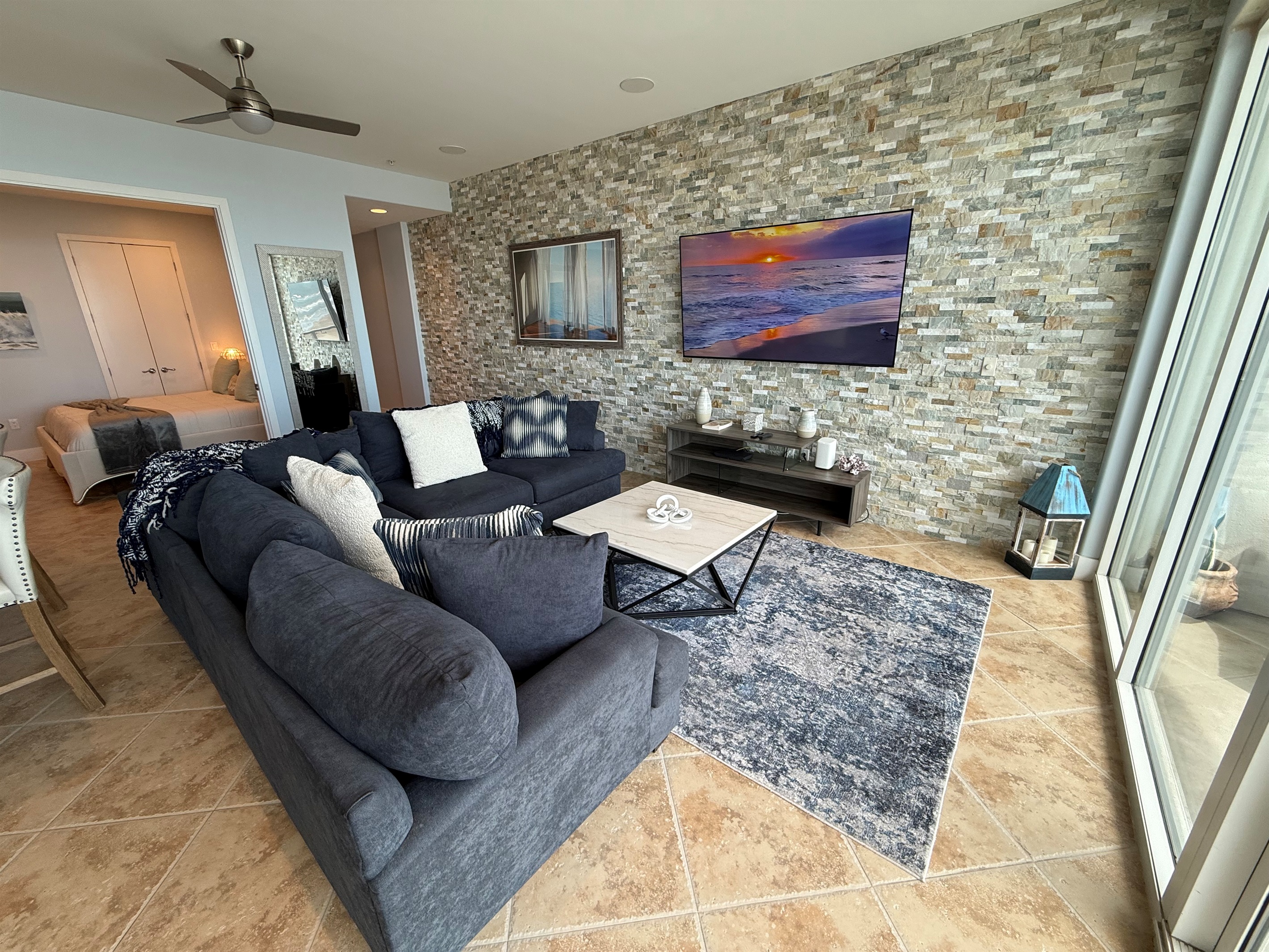New stone tile with 75" television!