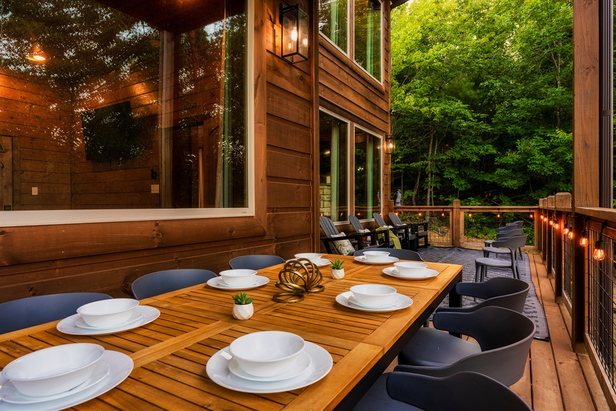 Dine on the back deck with string lights and nature views  