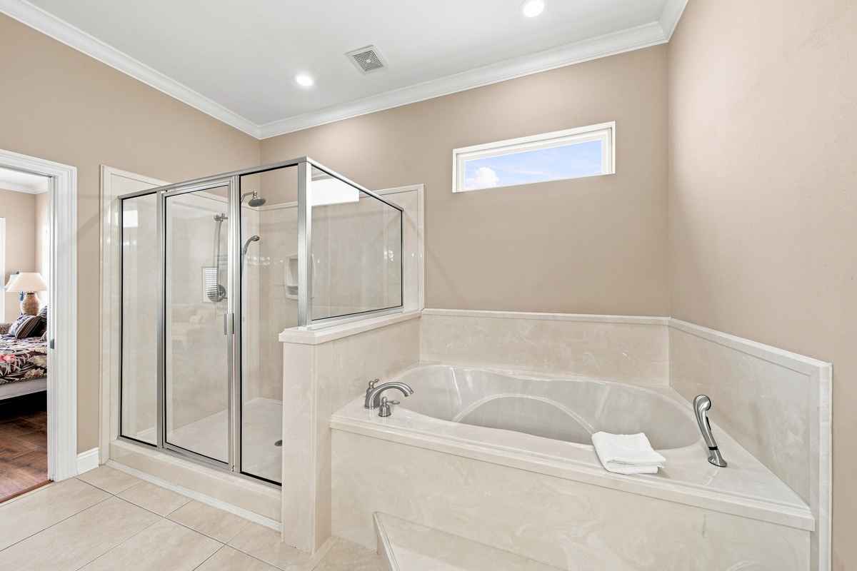 Bathroom with a glass shower and soaking tub