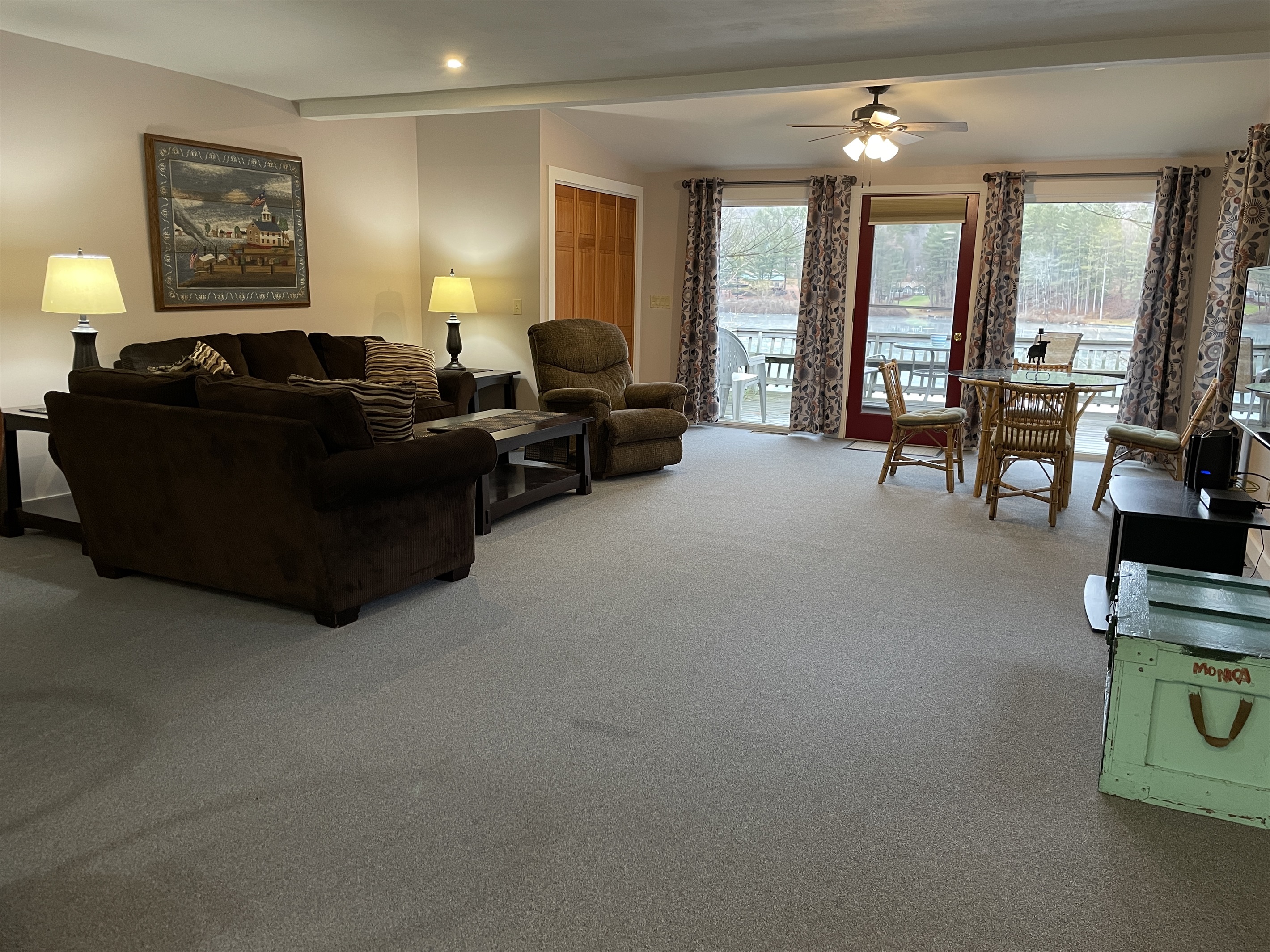Open living and dining area overlooking the lake