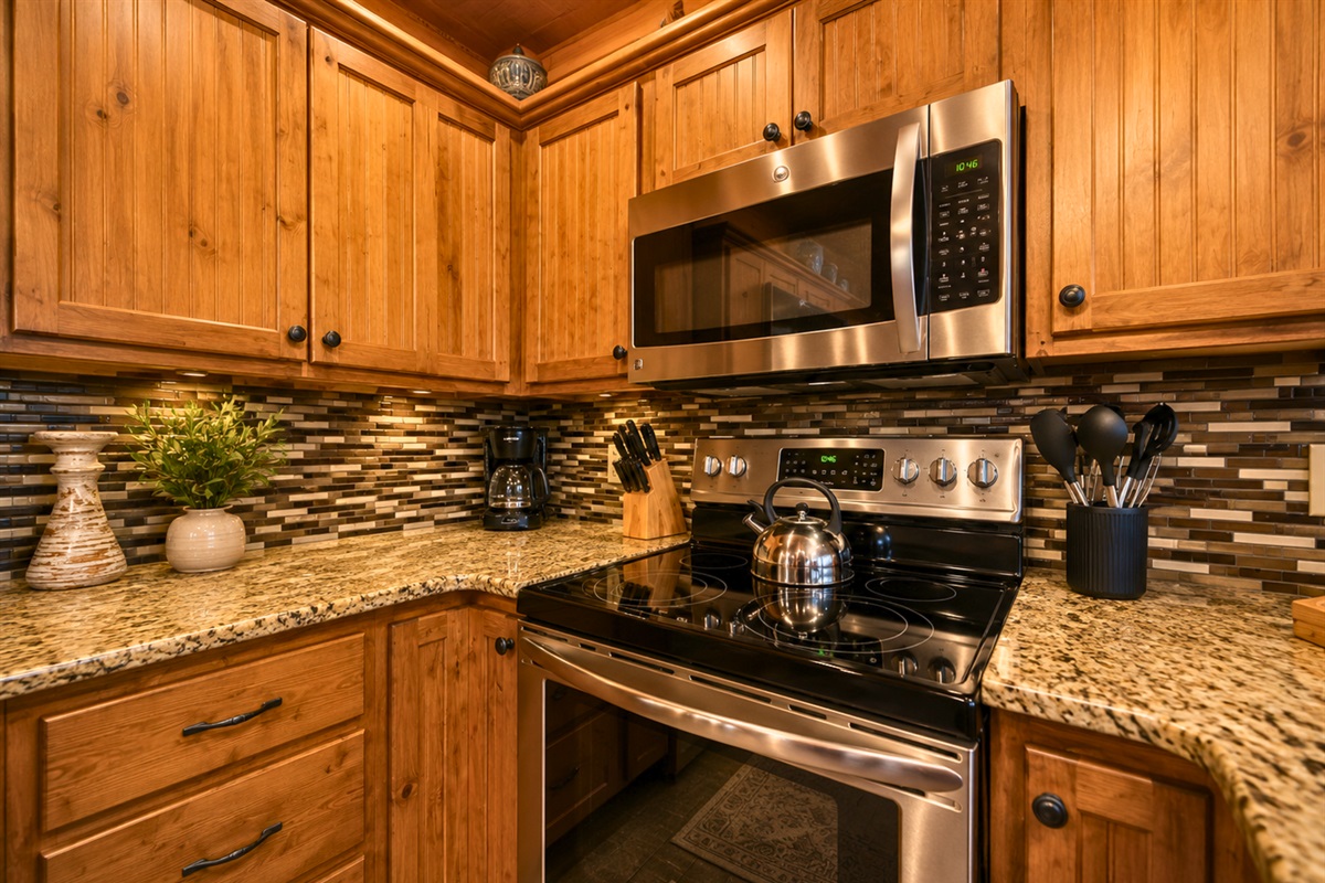 Modern appliances blend seamlessly with the wood interiors, creating a kitchen that feels both updated and cozy.