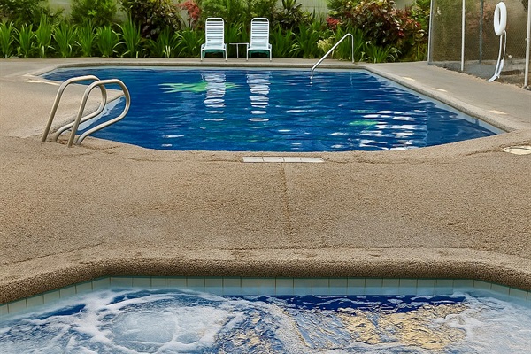 “Relax and refresh in the sparkling outdoor pool and jacuzzi — the perfect way to unwind after a day of exploring Waikīkī. Surrounded by lush greenery and island sunshine, this inviting space captures the essence of Hawai‘i leisure.