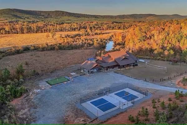 Aerial view of Sierra Sky perched on 12 private acres with mountain, valley, and river views.