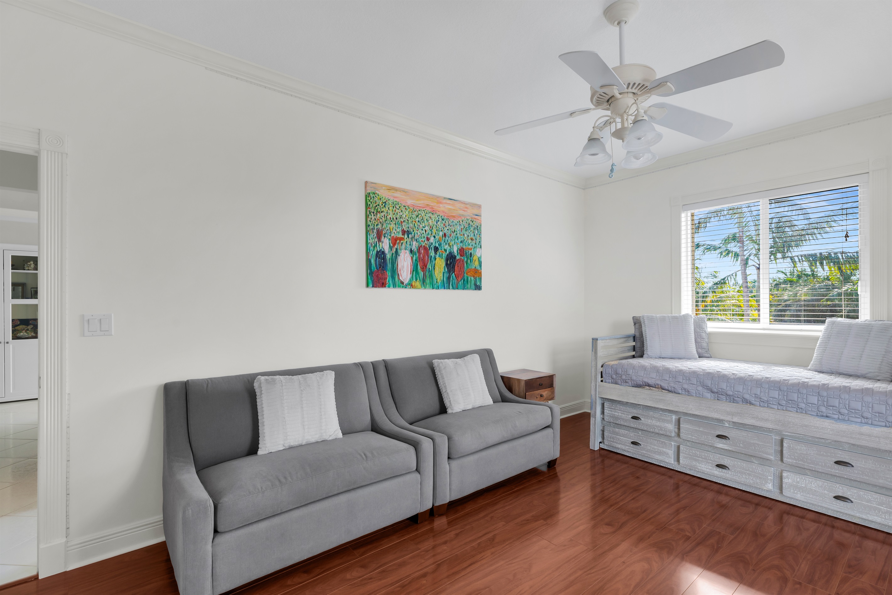 Guest bedroom featuring a twin with trundle and two oversized chair sleepers