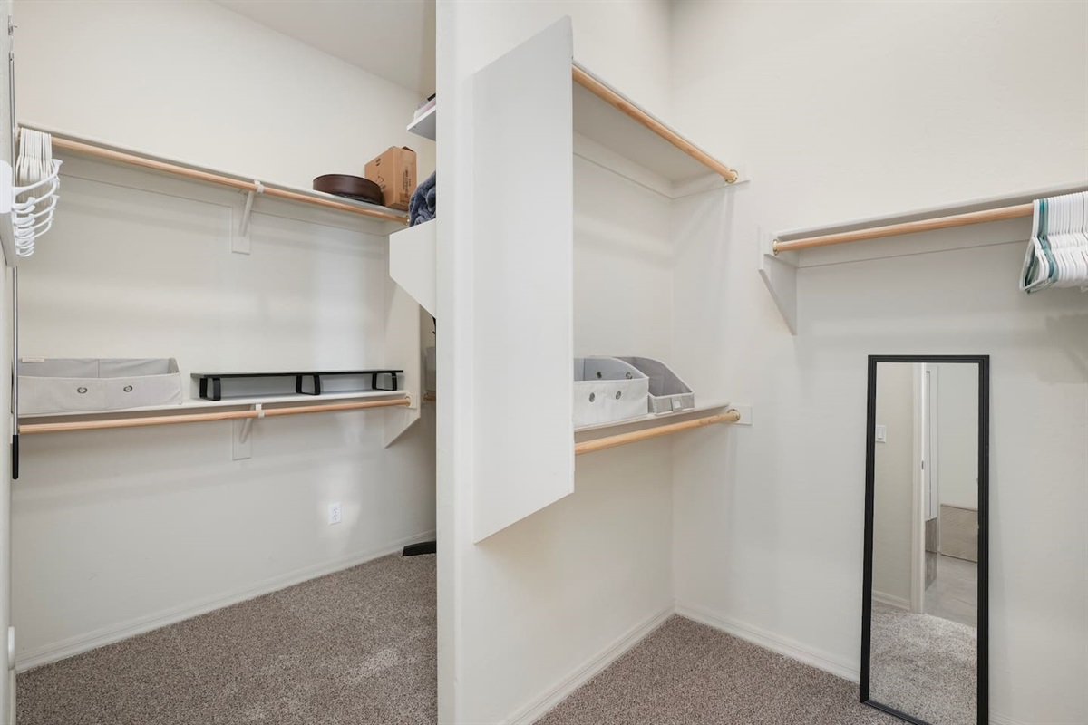 Large walk-in closet offering ample storage space during your stay.