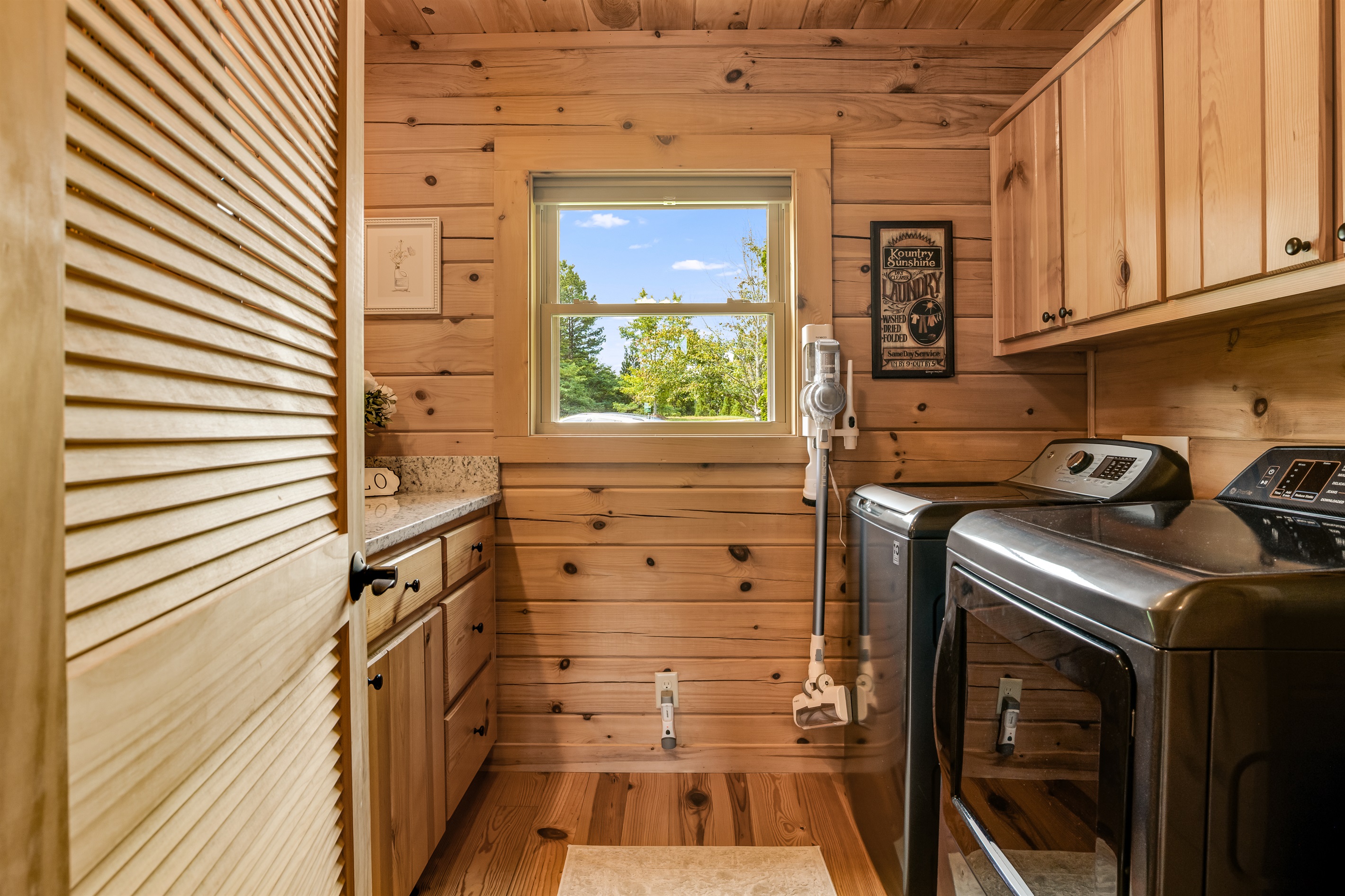 Laundry room with a full size washer and dryer