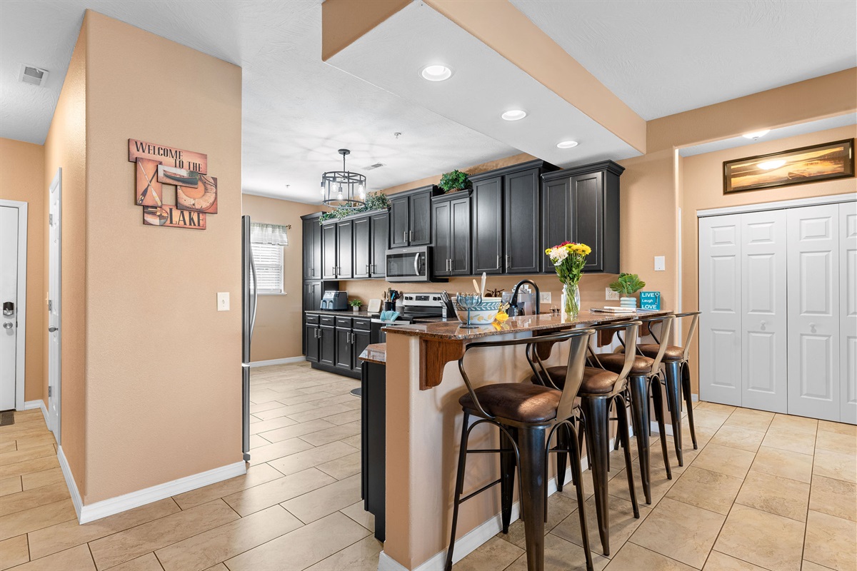 The kitchen is spacious and a great place to gather to cook meals together and enjoy spending time together.