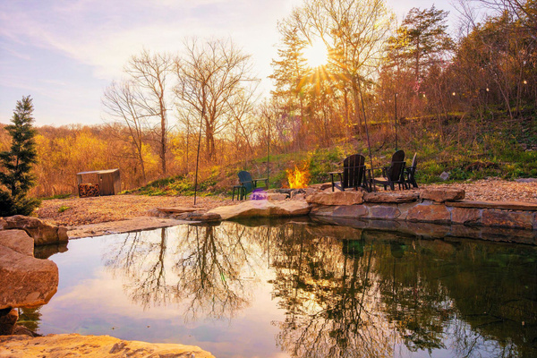 Immerse yourself in your own private Ozark swimming hole. The spring-fed natural grotto pool is filled by the flowing creek waters and incorporates natural stone surroundings and ledges for lounging, relaxing, or floating.