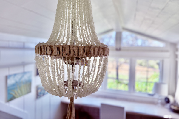 Chandelier made from sea glass -- the little pieces of glass that our ocean nicely tumbled and the artist found for this one of a kind piece. 