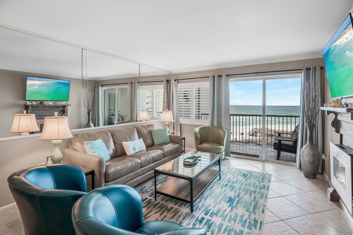 Stylish, spacious living space with GULF views from the 4th story balcony + leather furniture, Queen sleeper sofa, 58" Smart TV, Fireplace, and balcony access