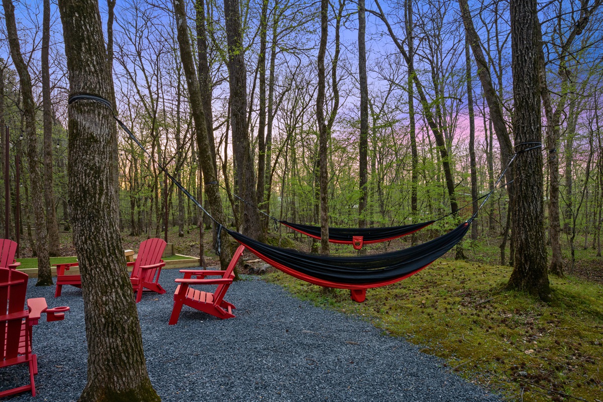 A hammock tucked between the trees invites you to slow down, relax, and take in the peaceful surroundings.