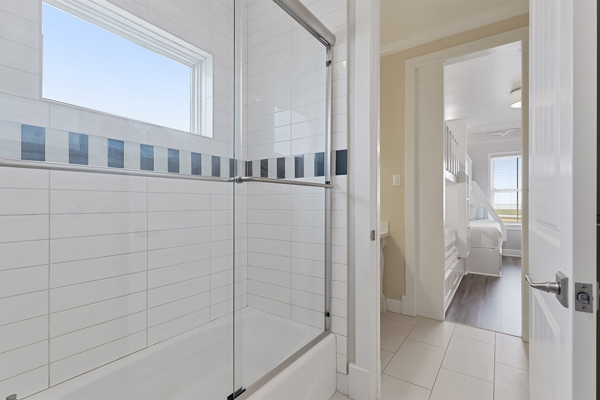 Full Bathroom #2: Glass enclosed tub/shower combo.