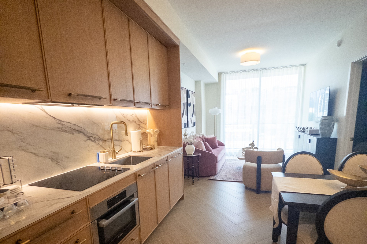 Bright open-concept layout where kitchen, dining and living blend into one airy, light-filled great room.