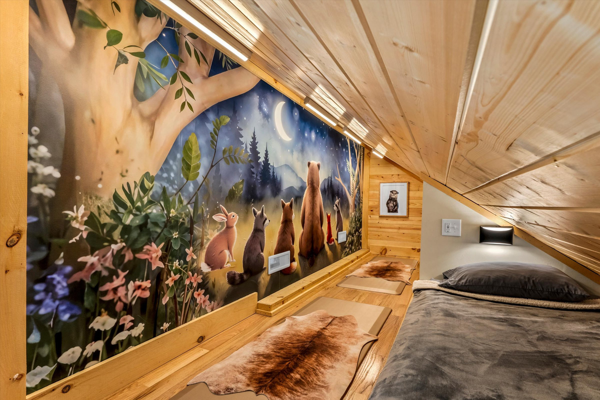 Custom built-in twin beds with individual reading lights, white noise machine and cozy bedding.