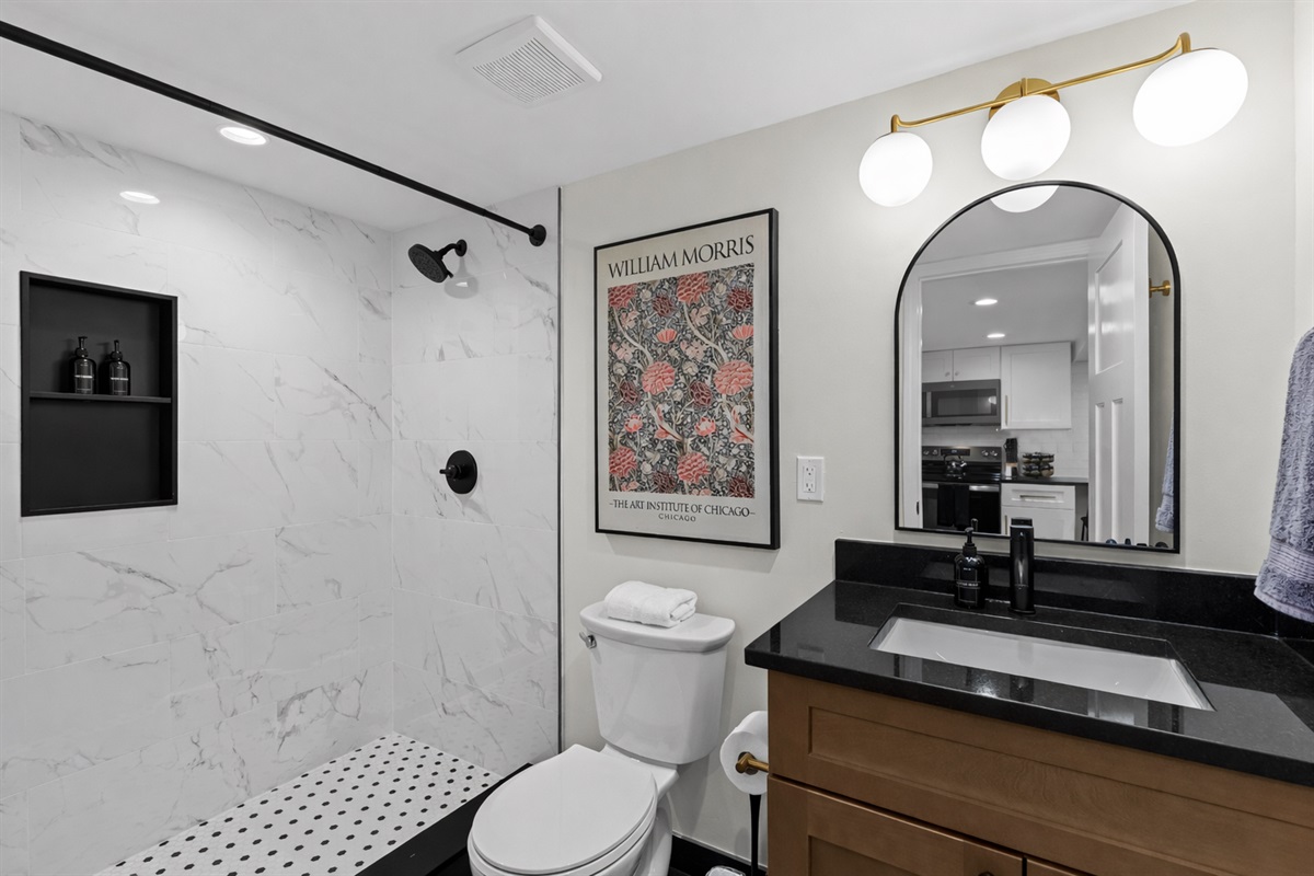Bright, spa-inspired bathroom with a walk-in tiled shower, modern fixtures, and elegant finishes—designed for a refreshing and relaxing daily routine.