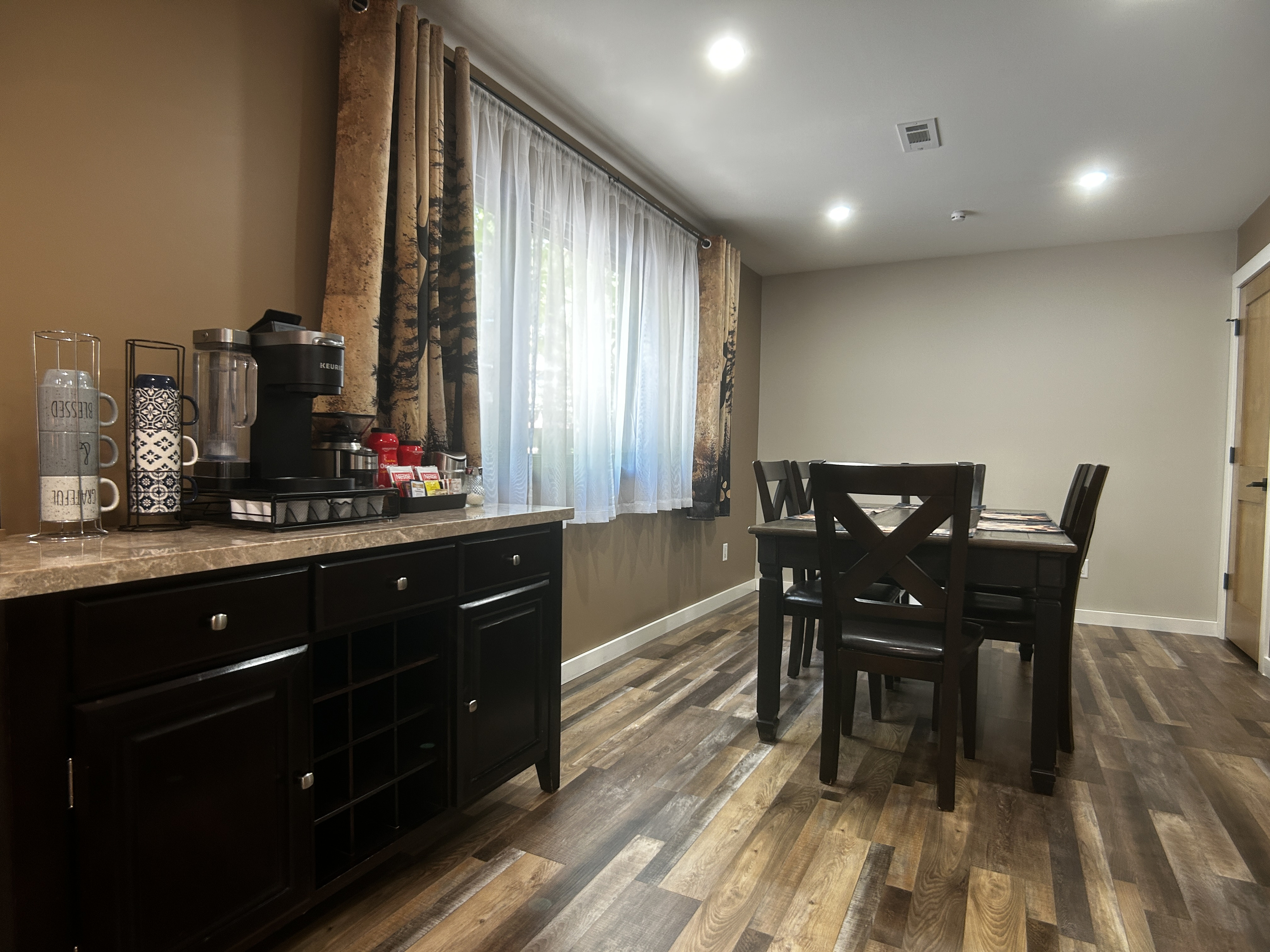 Beverage station has some decaf options available in both coffee and tea. Table provides seating for up to 6 people.