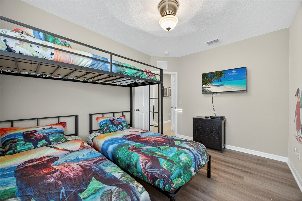Colorful room kids will love — bright bedding and wall art for a playful stay.