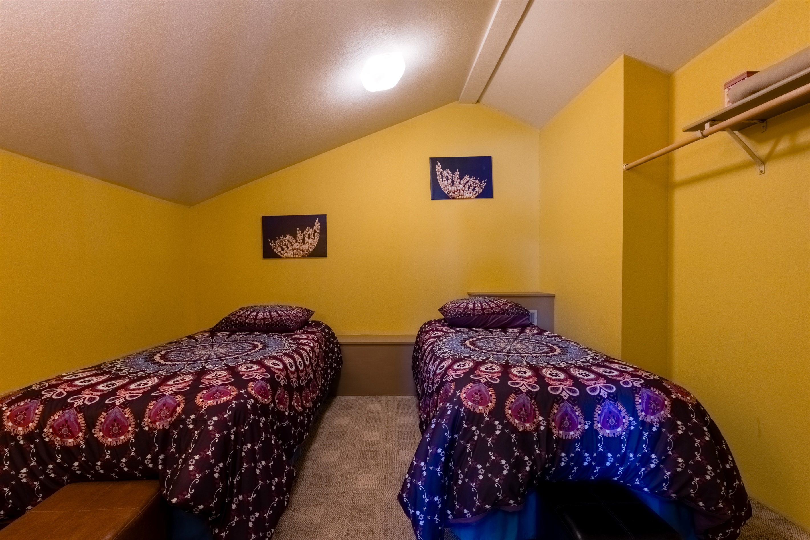 Loft bedroom with cozy twin beds and rec space.