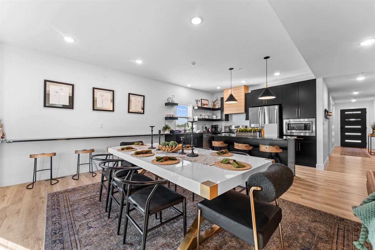 With the large dining table, kitchen island and built-in eat-in bar there is plenty of room for everyone to gather for a meal.