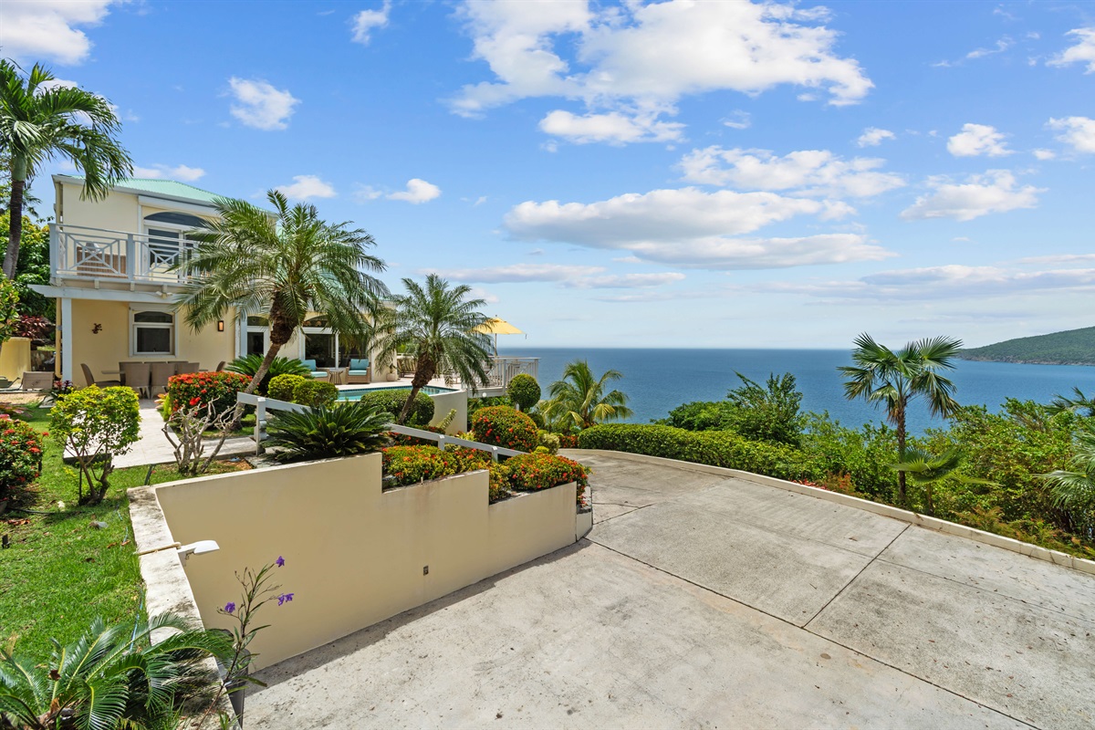 Tropical landscaping, lush plants, and walkways that make even coming home feel like a vacation.