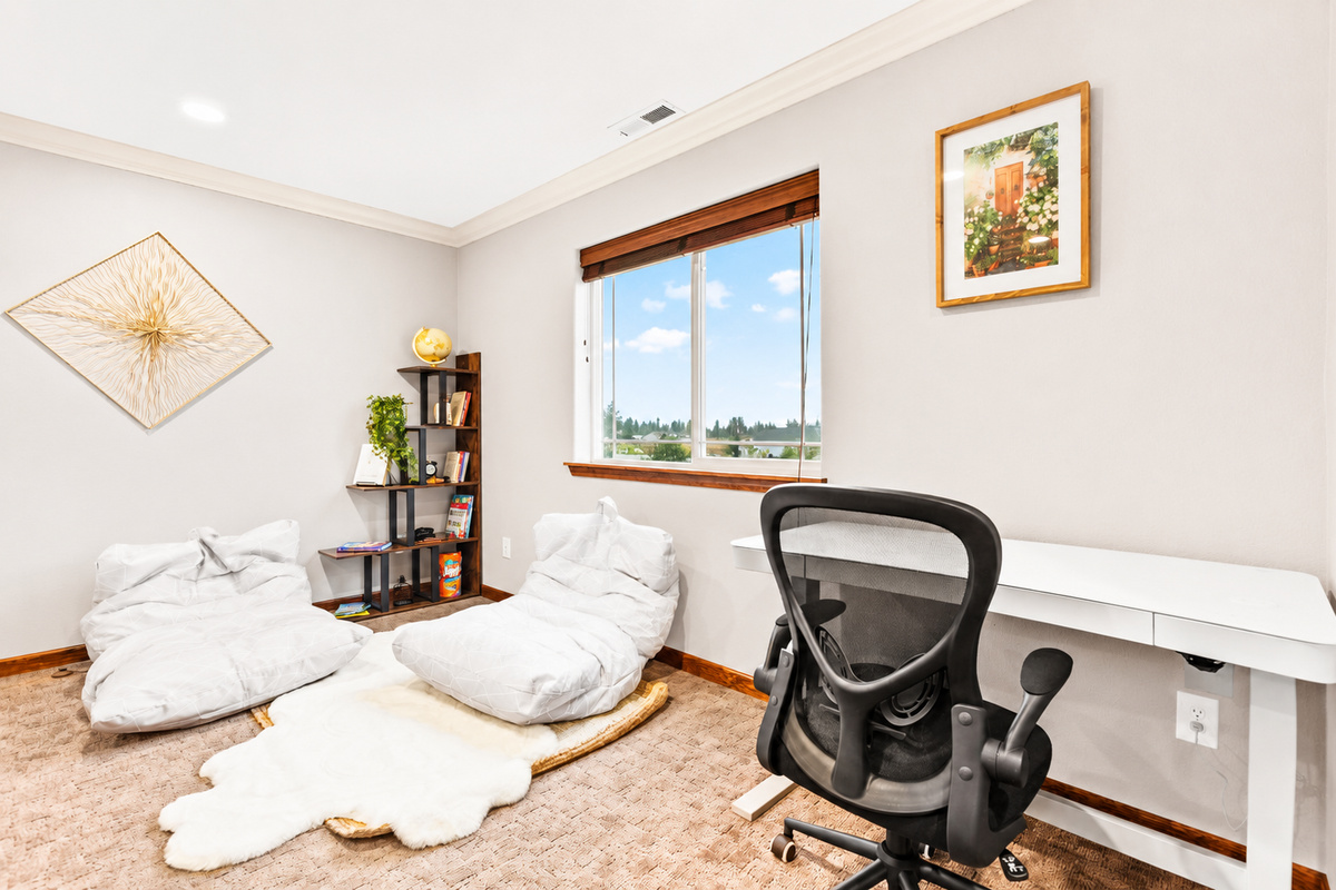 Find your perfect balance of productivity and relaxation in our workspace, featuring a height-adjustable desk and cozy reading nook. Whether you're diving into work or escaping into a good book, this versatile area caters to your every need.