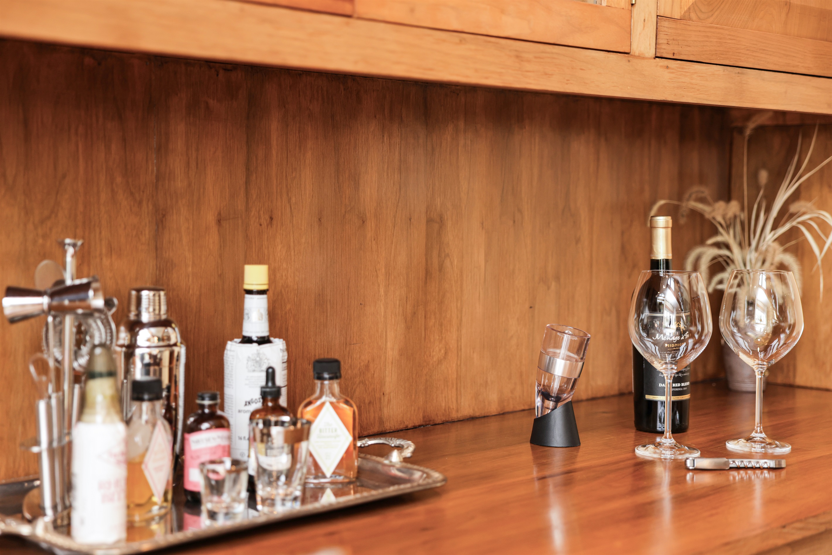 Bar set up along with ice bucket, wine aerator, ane more! White and red stemmed and non-stemmed glassware, and rocks glasses.