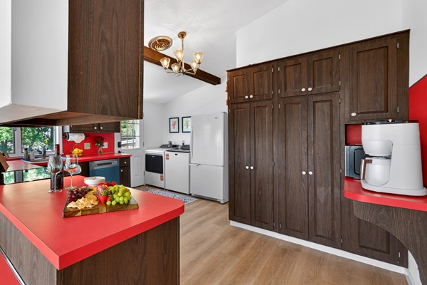 Beautifully designed kitchen with warm wood accents and modern appliances, perfect for everything from quick breakfasts to cozy dinners and late-night conversations.