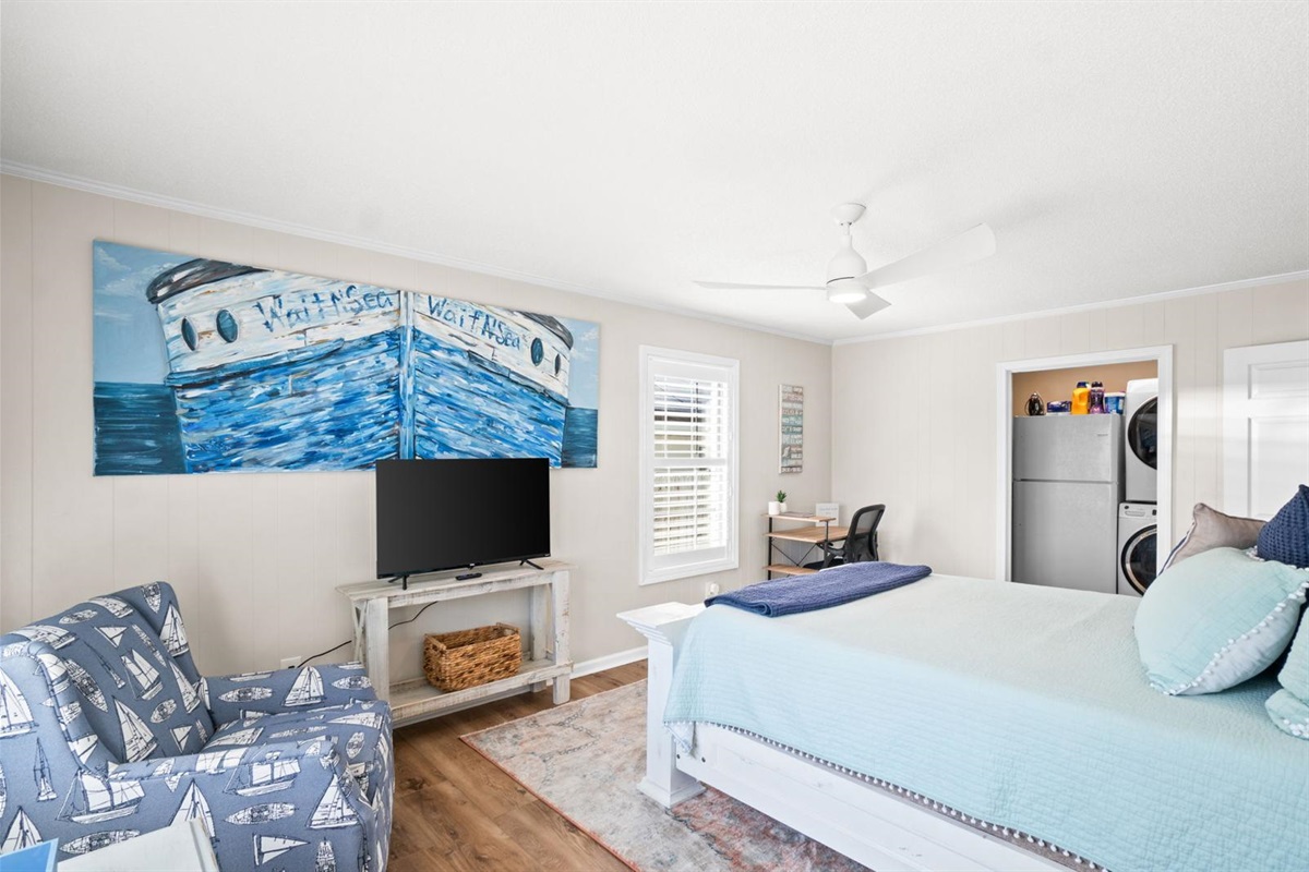 Second bedroom with queen bed, workspace and smart TV