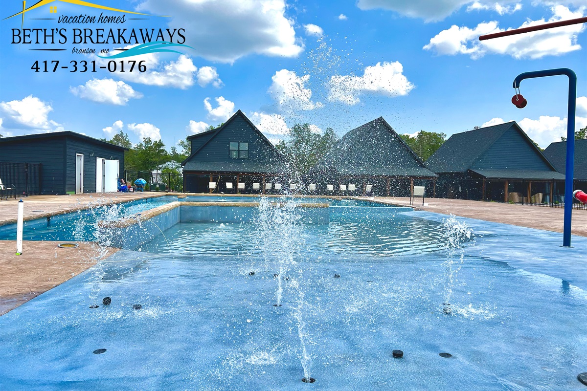 Zero-entry community pool with slide and splash pad