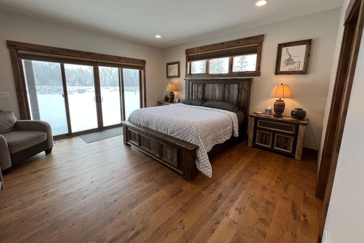 main floor master with king bed and attached bathroom