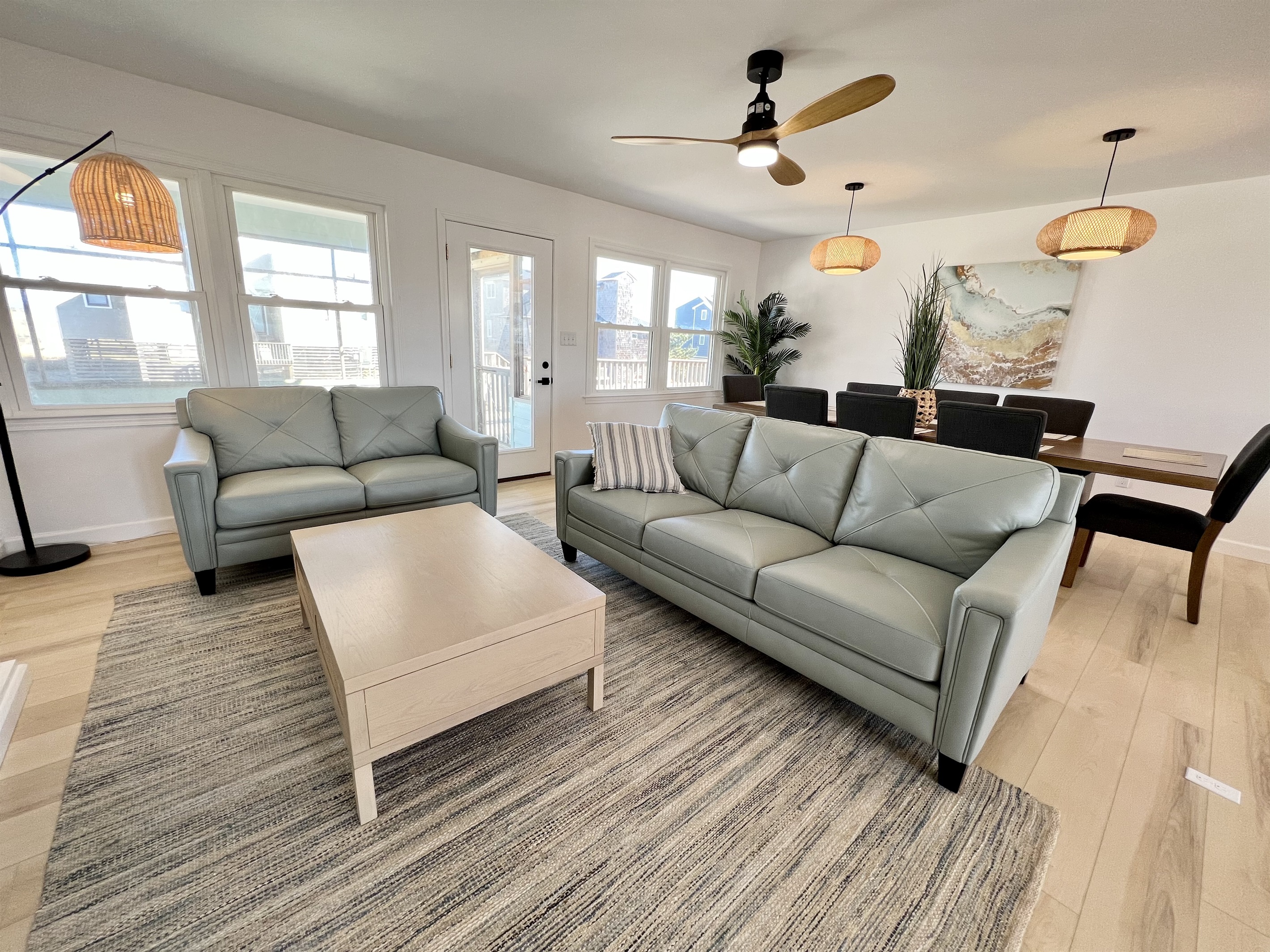 Comfy couches in front of the large coffee table and 58" Roku TV