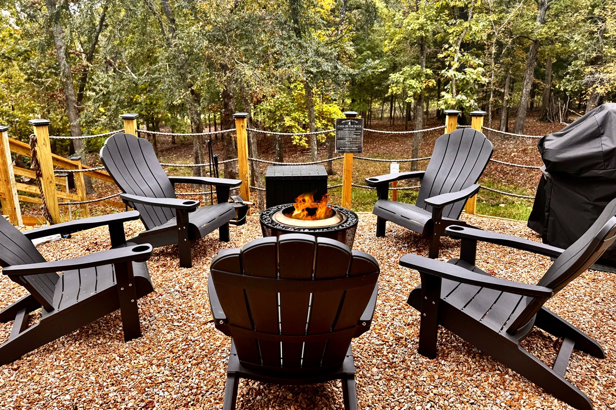 Outdoor fire pit with seating and grill