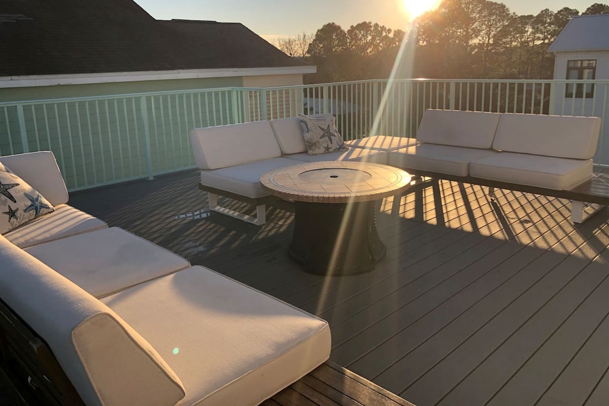 Unwind on the luxury upstairs deck with plush outdoor couches.  Perfect for stunning sunsets!  Enjoy an immersive movie night under the stars with our outdoor projector. The ultimate Blue Mountain Beach retreat!