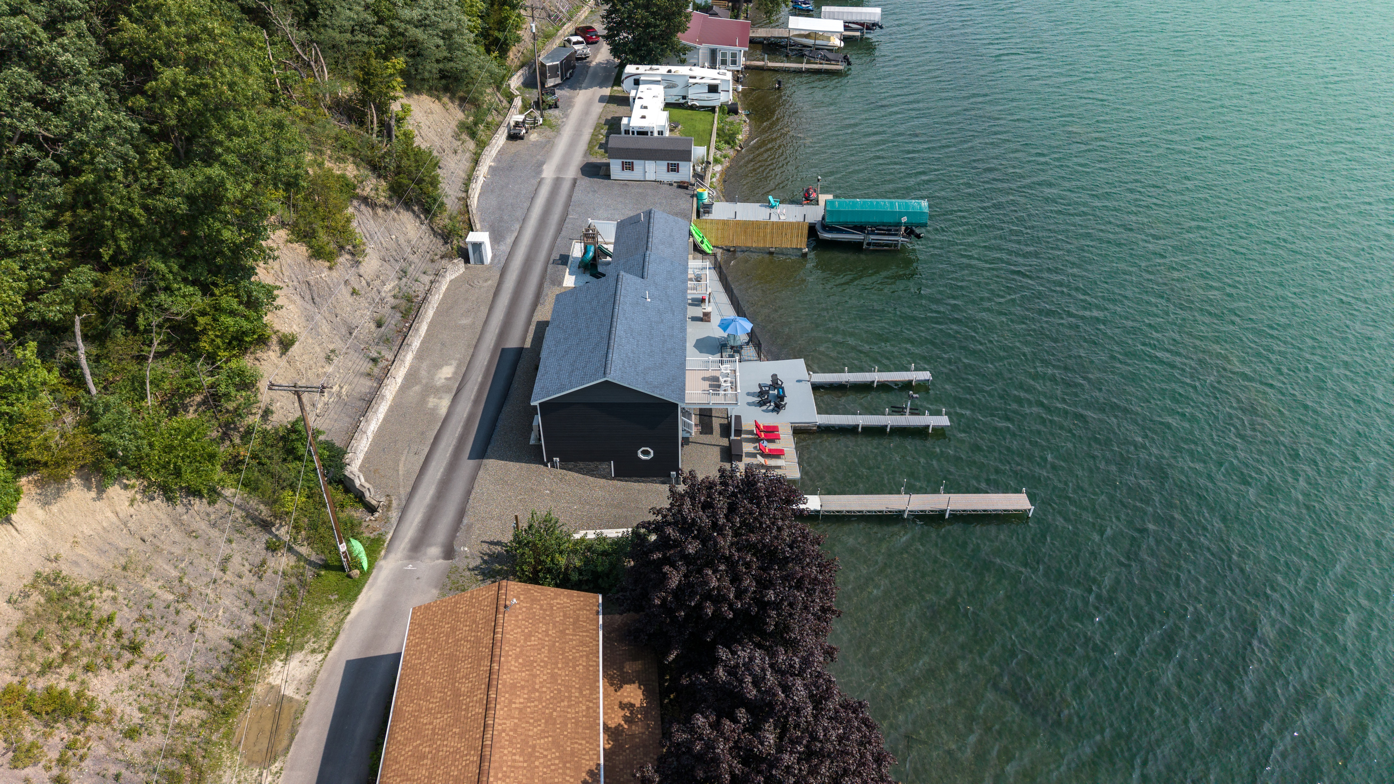 Waterfront property positioned between road and lake