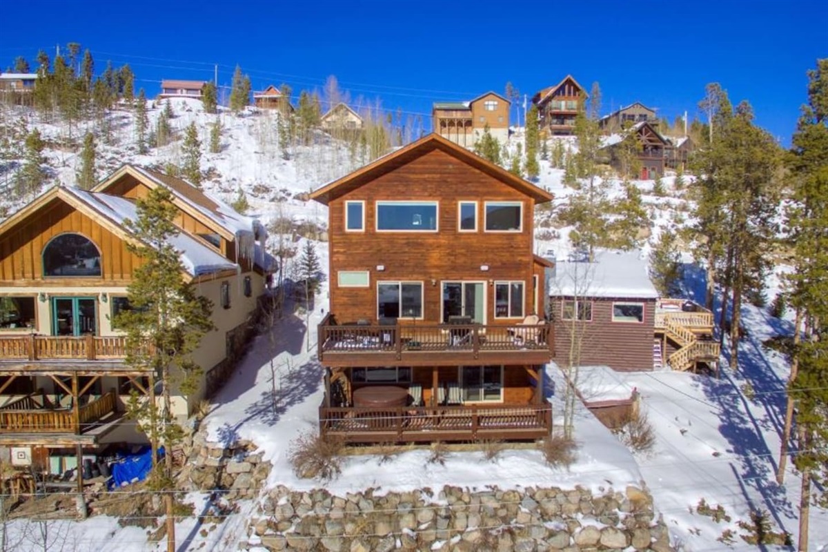 Southern side of the house facing the lakes and mountains. Two full-size decks with abundant space for lounging, BBQing, hot tubbing and more